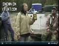 A group of hunters (including the woman) drinking beer in the final part of the clip.